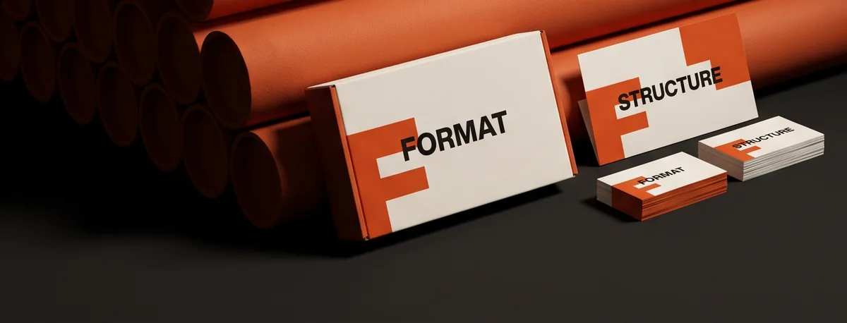The finished FORMAT and STRUCTURE identity on a box and a stack of business cards
