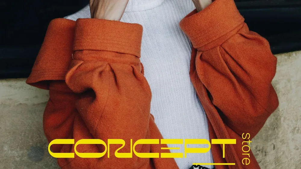 Concept Store: the wordmark over an orange wool coat