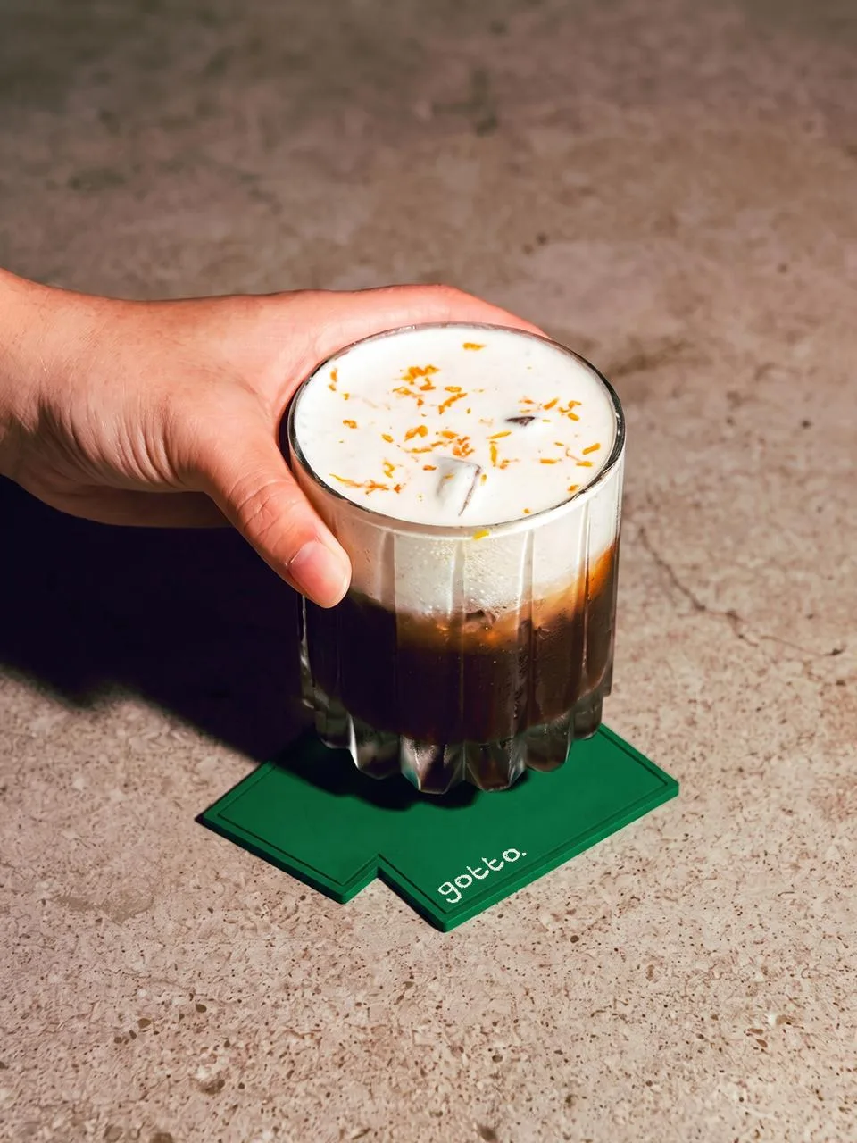 GOTTO: an iced coffee on a green gotto. coaster