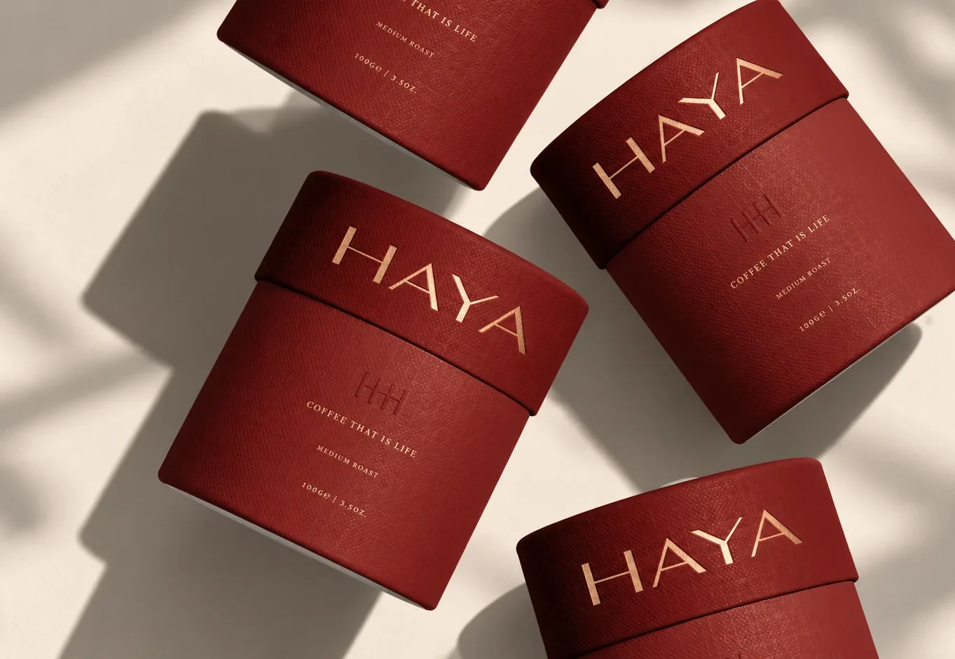 Haya: red coffee tubes with the gold HAYA wordmark