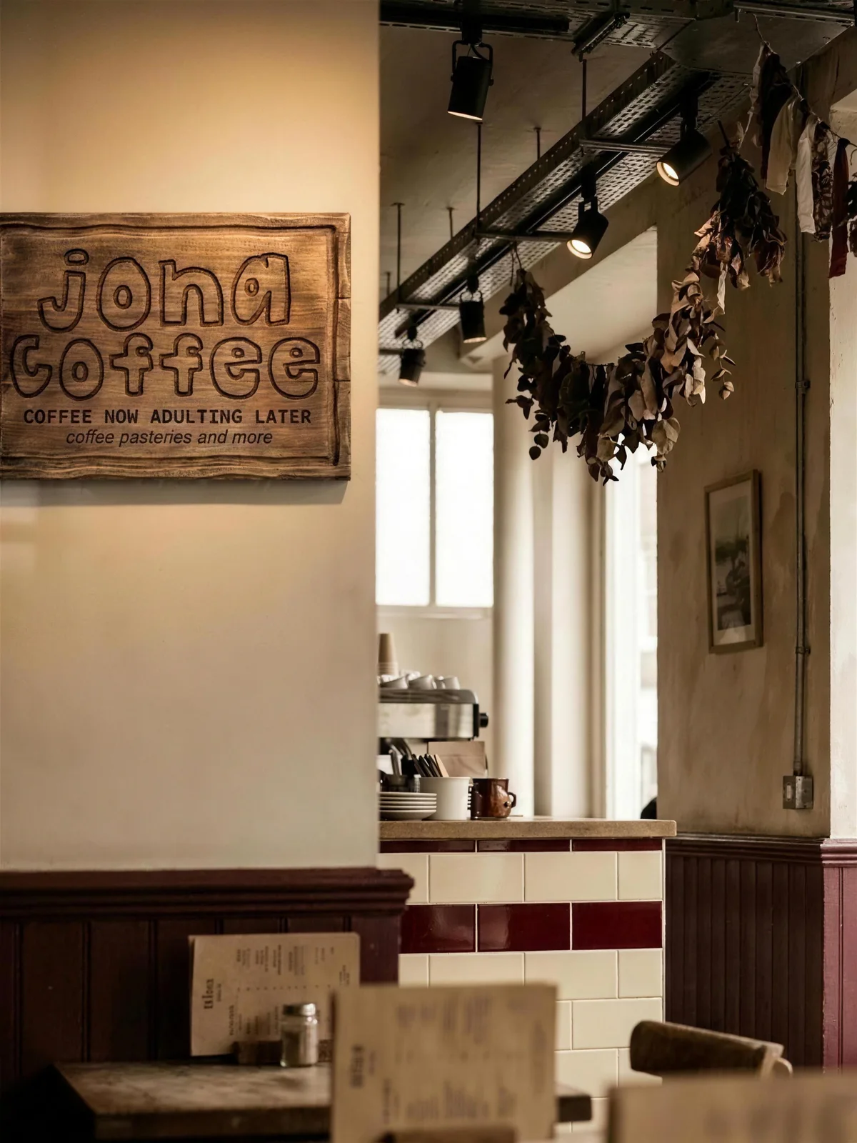 Jona Coffee: the routed sign above the counter