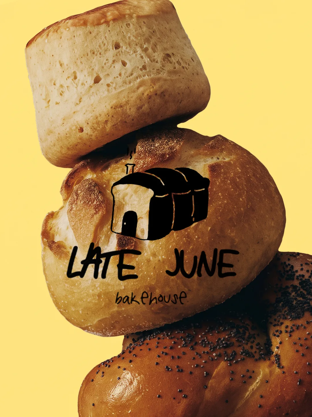 Late June Bakehouse: the logo over a stack of fresh bread