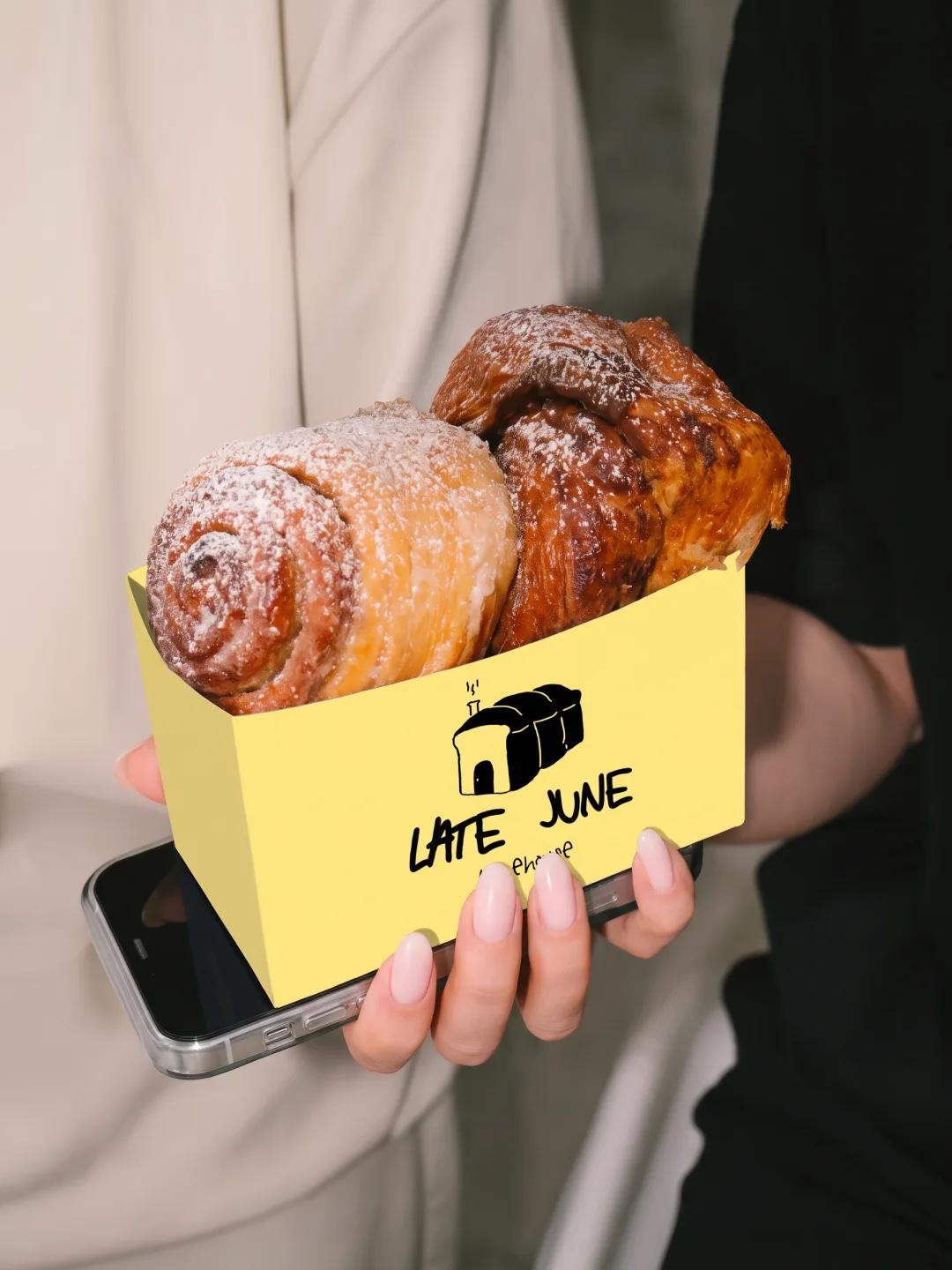 Late June Bakehouse: two pastries in a yellow takeaway box