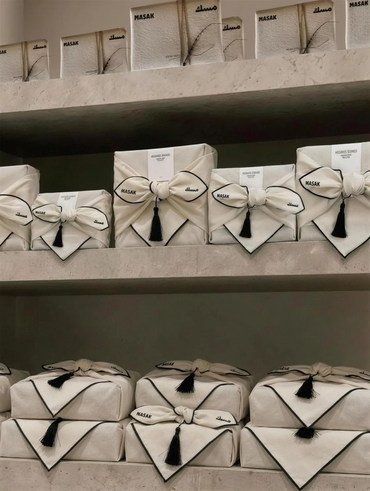 MASAK: the store shelves of cloth-wrapped boxes, the brand holding a room