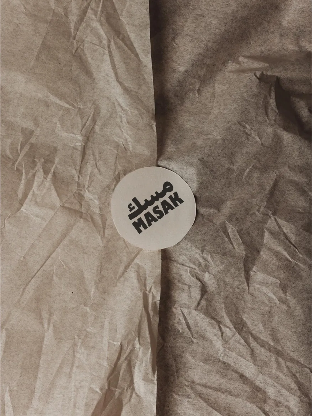 MASAK: the small round seal closing a fold of kraft tissue