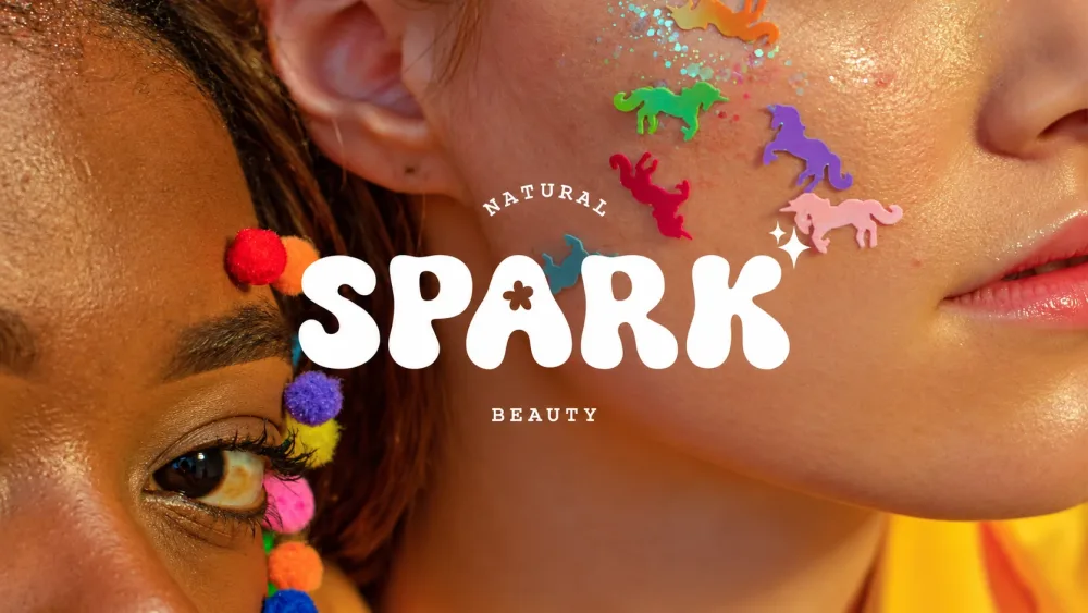 Spark Beauty: the SPARK wordmark over two faces with pom-poms and unicorn glitter
