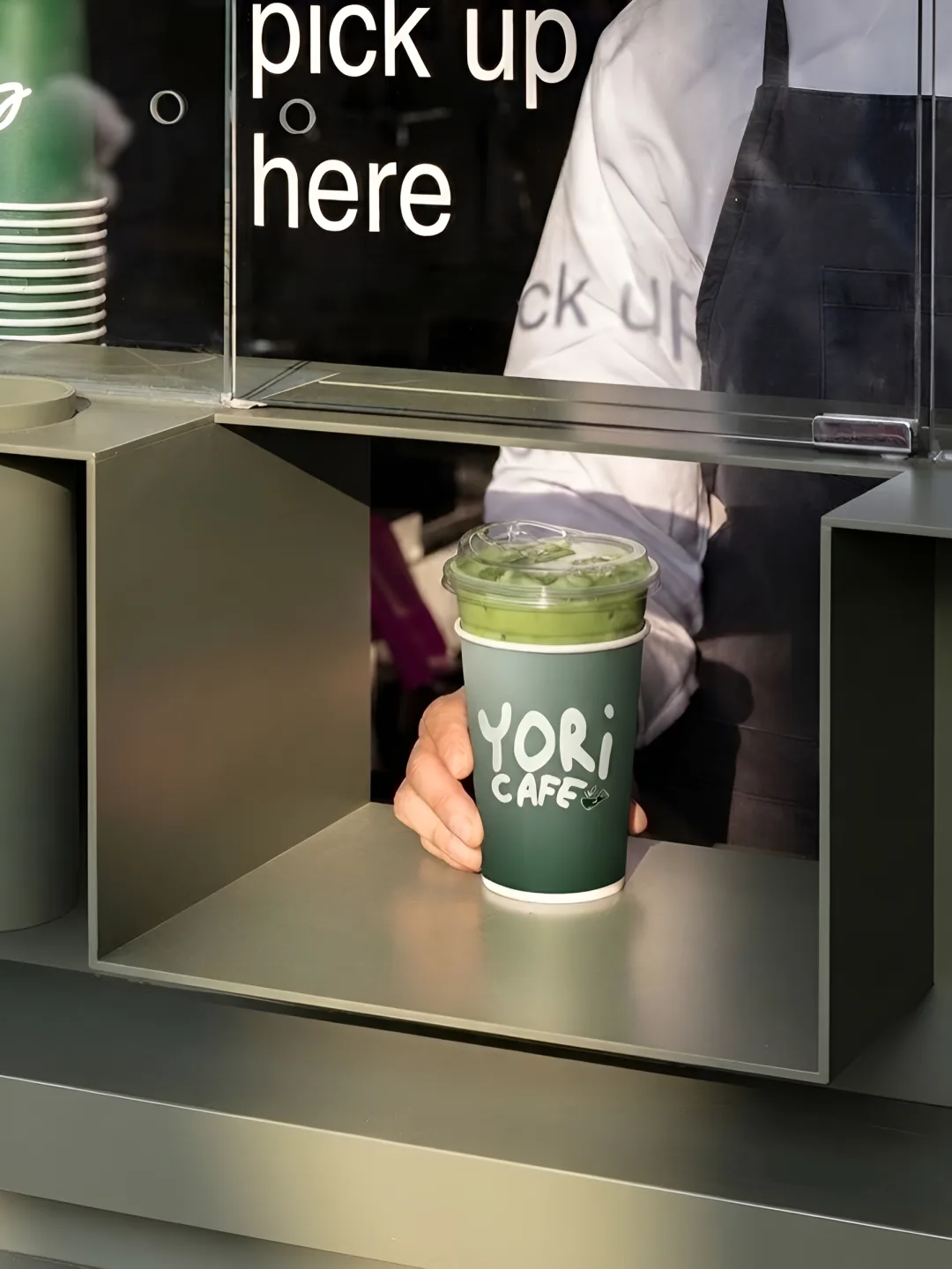 YORI CAFE: an iced matcha in a YORI CAFE takeaway cup at the pick-up window